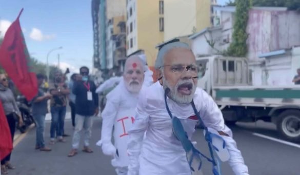 A screengrab shows opposition protesters dressed as Indian Prime Minister Narendra Modi during a demonstration held in Male’ on Thursday (Screengrab from a video on social media)