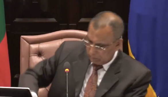 A screengrab of the moment MP Hassan Afeef reached to his pocket to take out his cellphone to answer the mysterious phone call which allegedly led to the abrupt adjournment of Wednesday's Parliament sitting