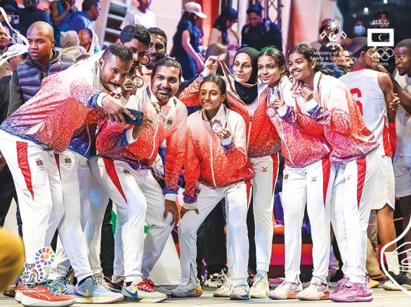 Players of the Maldives men’s and women’s 3x3 basketball teams celebrate during the medal ceremony at the Indian Ocean Island Games in Madagascar. (Photo: X/ @olympicmv)