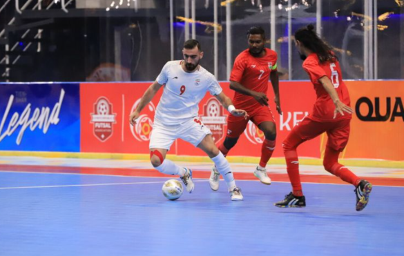 Saeid Ahmadabbasi (9) dribbles past two Maldivian players in the match on Saturday, 7 October 2023. (Photo: AFC)