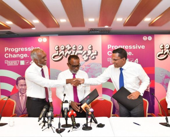 MNP leader Colonel (Retired) Mohamed Nazim shakes hands with President-elect Mohamed Muizzu during an event held on 12 September 2023 to announce the signing of the coalition agreement between PPM-PNC and MNP. (Photo: MNP)